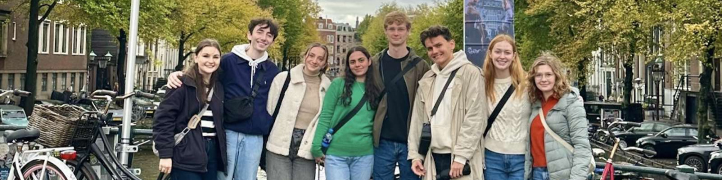 91̽ student Peter with seven other students on a bridge in Brussels, Belgium